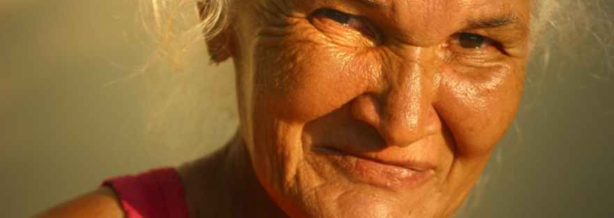 close-up of older woman's face in golden sunlight